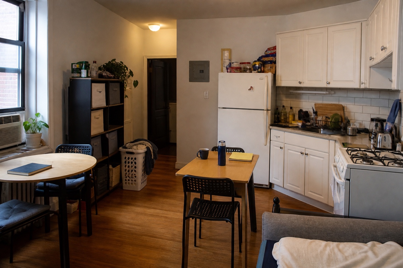 Modest shared kitchen and common area in furnished NYC intern housing