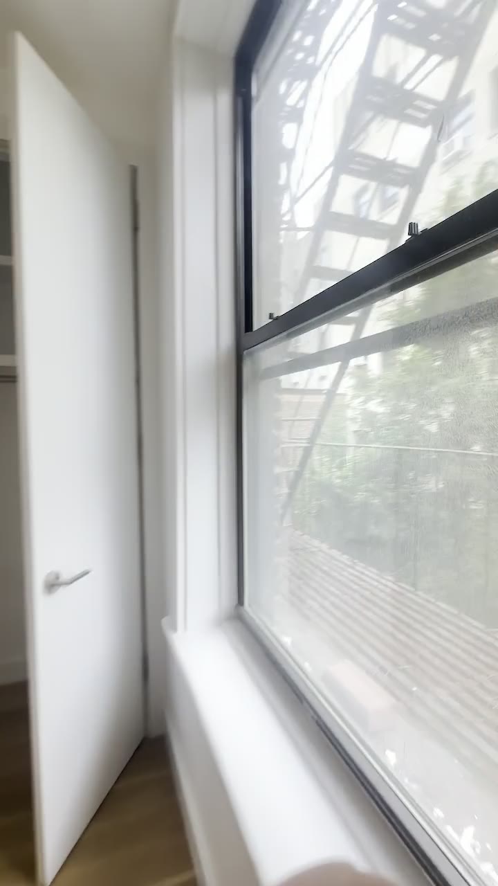 Apartment window and exterior exposure documented during a showing